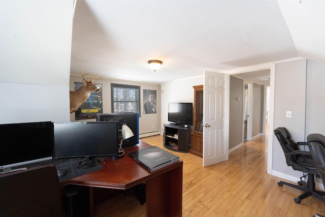 office with baseboards, light wood-type flooring, and baseboard heating