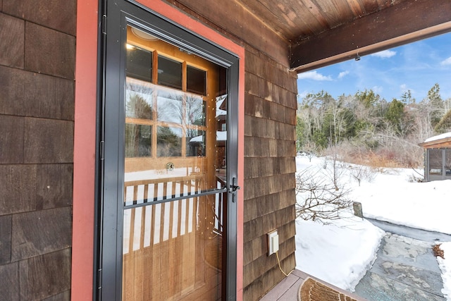 view of snow covered property entrance