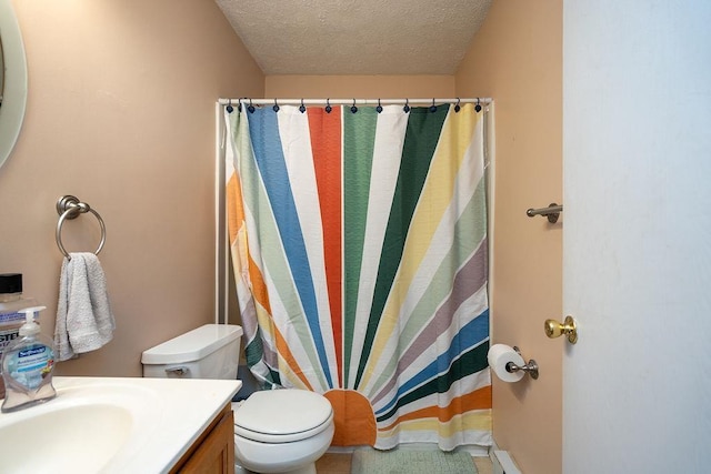 full bath with curtained shower, a textured ceiling, vanity, and toilet