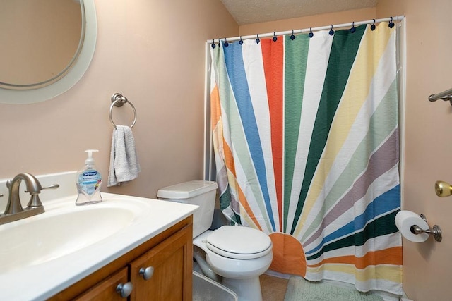 bathroom with vanity, toilet, a shower with curtain, and a textured ceiling