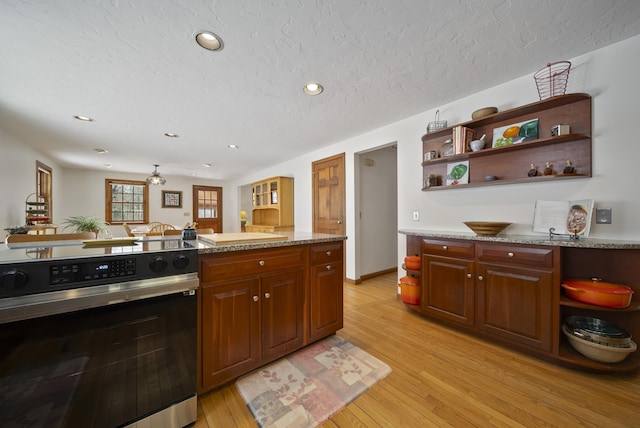 kitchen featuring open shelves, recessed lighting, electric stove, a textured ceiling, and light wood-type flooring