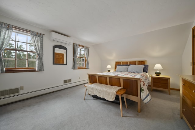 bedroom featuring vaulted ceiling, multiple windows, baseboard heating, and a wall mounted AC