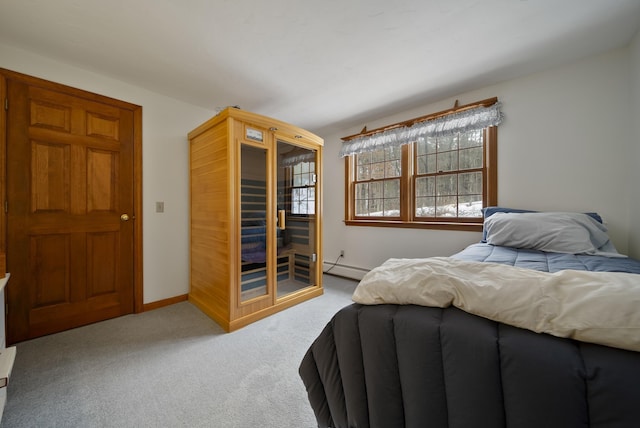 bedroom featuring a baseboard radiator, carpet floors, and baseboards