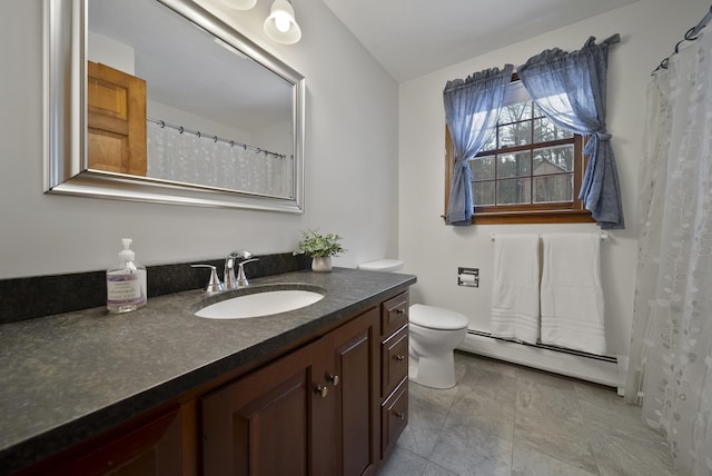 bathroom featuring baseboard heating, toilet, and vanity