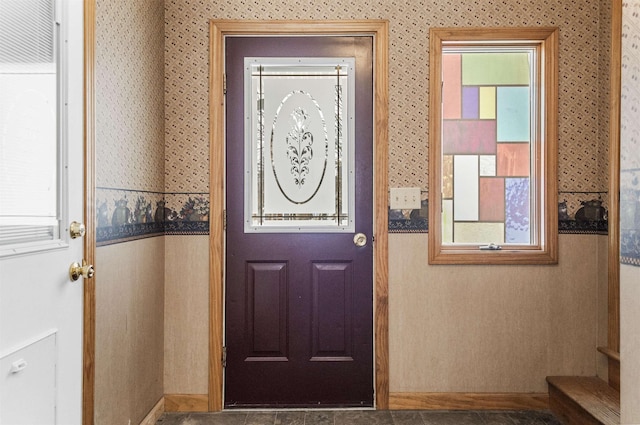 doorway featuring wallpapered walls