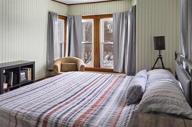 bedroom featuring wallpapered walls