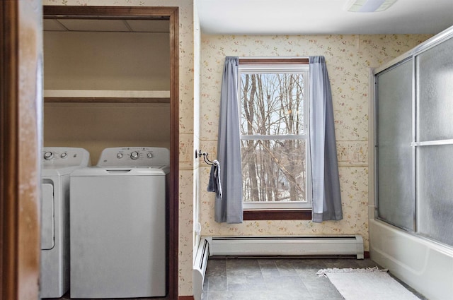 laundry room with washer and clothes dryer, baseboard heating, and wallpapered walls