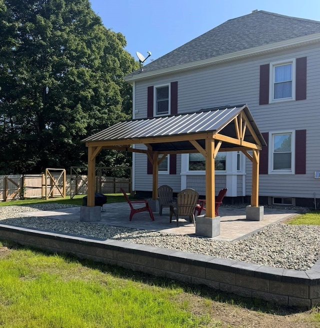 view of patio with a gazebo and fence