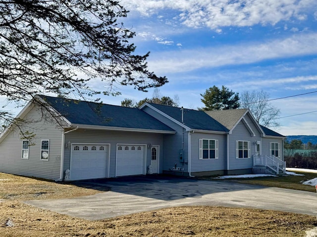 view of front facade with driveway and a garage