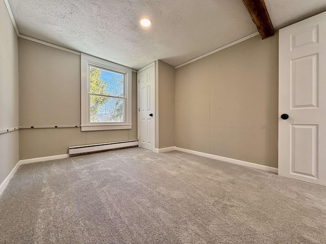 empty room featuring a baseboard radiator, carpet floors, a textured ceiling, and baseboards