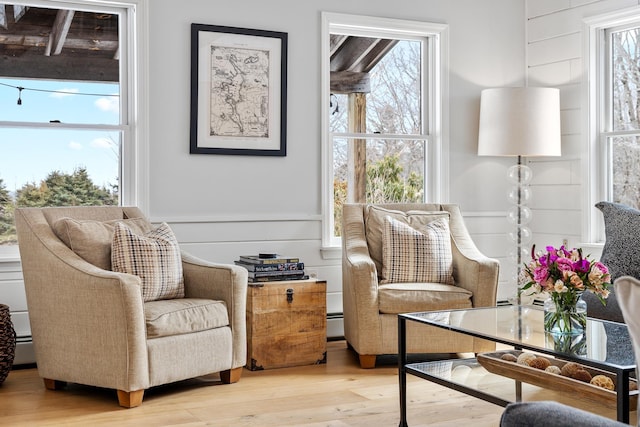 sitting room featuring light wood-style flooring