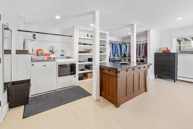 washroom with separate washer and dryer, recessed lighting, and laundry area