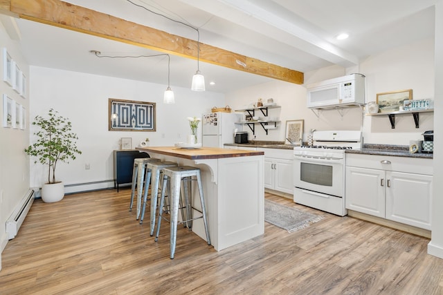 kitchen with white appliances, wooden counters, open shelves, a baseboard heating unit, and a kitchen breakfast bar