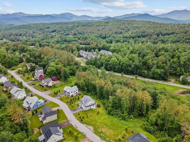 aerial view with a mountain view and a view of trees