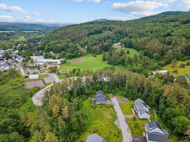 aerial view featuring a wooded view