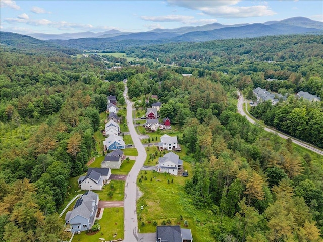 bird's eye view featuring a mountain view and a view of trees