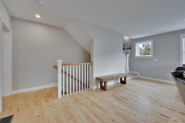 interior space featuring recessed lighting, baseboards, visible vents, and wood-type flooring