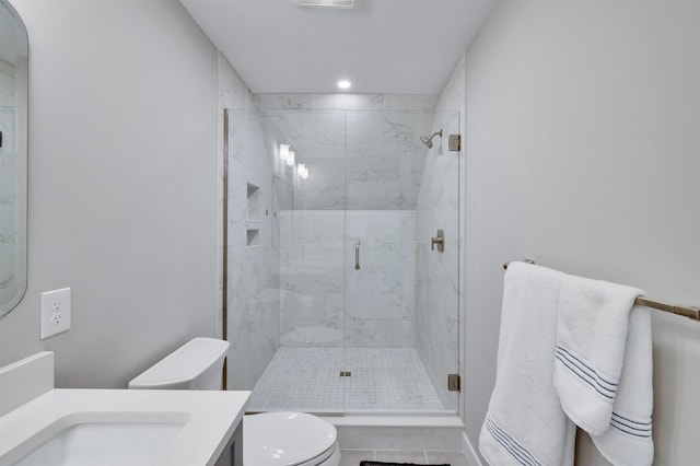 bathroom with vanity, visible vents, a marble finish shower, recessed lighting, and toilet