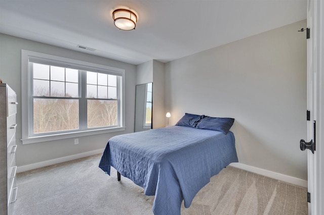 bedroom featuring carpet, visible vents, and baseboards