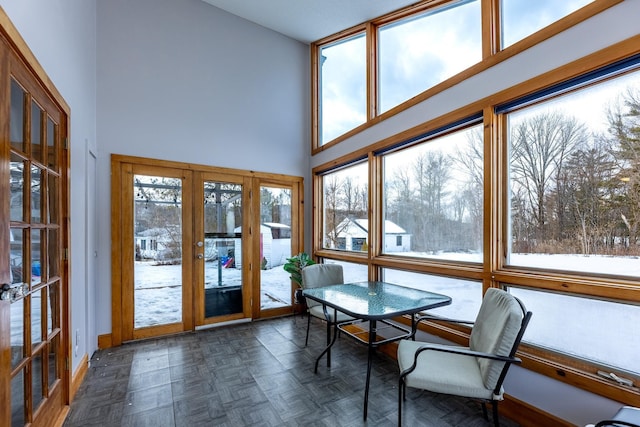 unfurnished sunroom with french doors