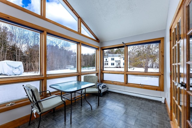 sunroom with baseboard heating and lofted ceiling