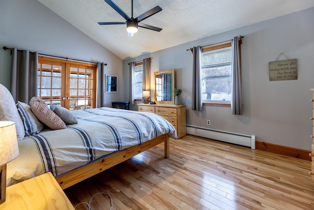 bedroom featuring light wood-style flooring, a textured ceiling, french doors, a baseboard radiator, and vaulted ceiling