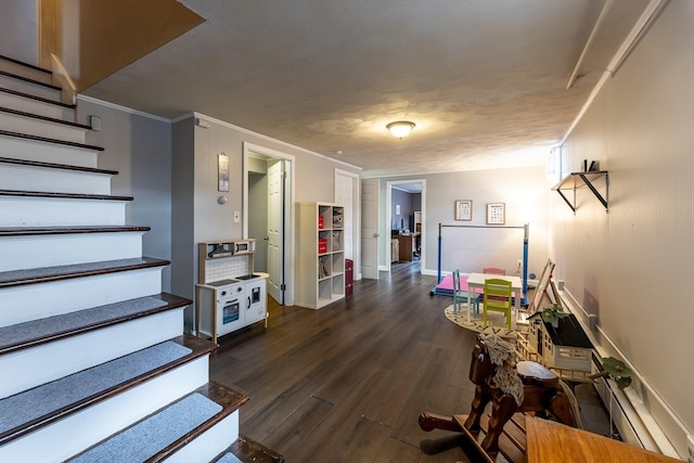 dining room featuring stairway, baseboards, dark wood-type flooring, and crown molding