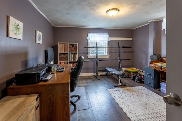 office space featuring baseboards, a textured ceiling, dark wood-style floors, and ornamental molding