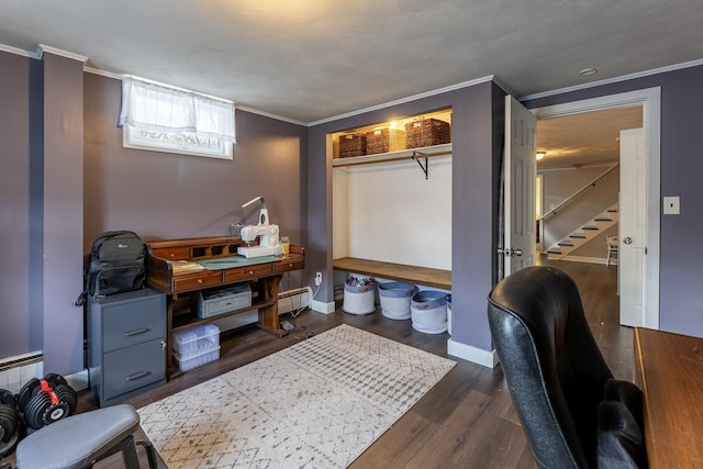 office area featuring baseboard heating, ornamental molding, baseboards, and wood finished floors