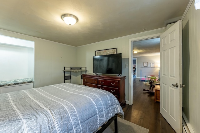 bedroom featuring dark wood-style floors and ornamental molding