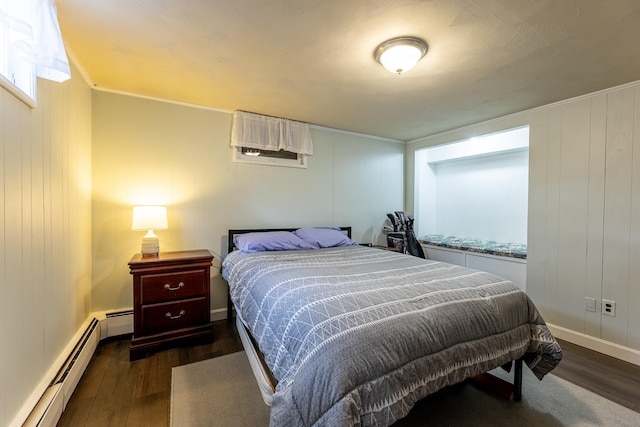 bedroom with baseboards, dark wood-style flooring, and a baseboard radiator