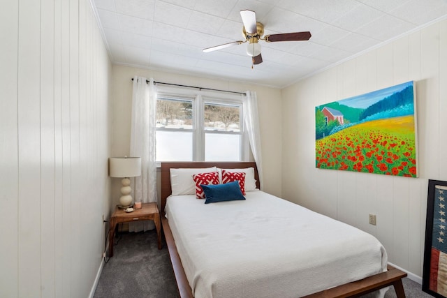 carpeted bedroom with crown molding and ceiling fan