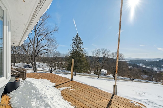 yard covered in snow featuring a balcony