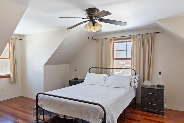 bedroom with lofted ceiling, wood-type flooring, and ceiling fan