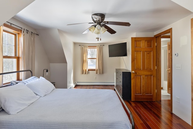 bedroom with dark wood-type flooring, baseboard heating, and ceiling fan