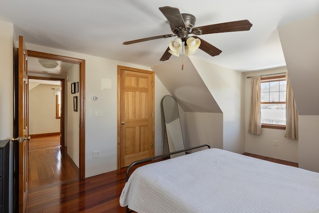 bedroom with a ceiling fan and wood-type flooring