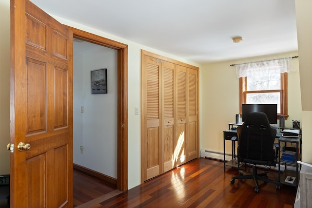 office space with a baseboard heating unit, baseboards, and dark wood-style flooring