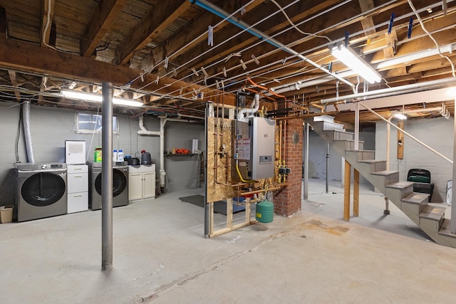 unfinished below grade area with stairway, heating unit, and separate washer and dryer