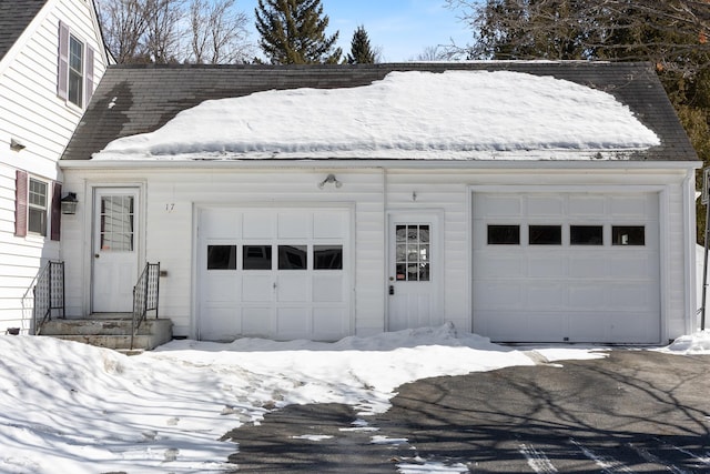 view of snow covered garage