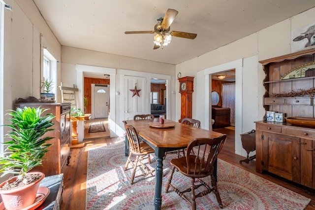 dining area featuring ceiling fan and wood finished floors