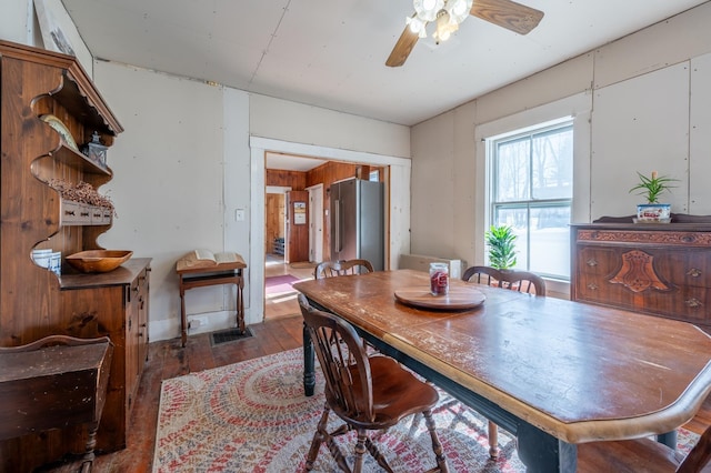 dining room with hardwood / wood-style flooring and ceiling fan