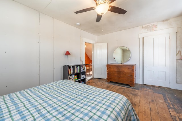 bedroom with a closet and hardwood / wood-style flooring