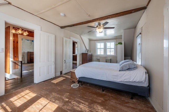 bedroom featuring beam ceiling and an inviting chandelier