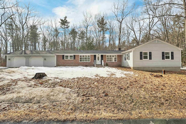 single story home featuring brick siding, a chimney, and an attached garage