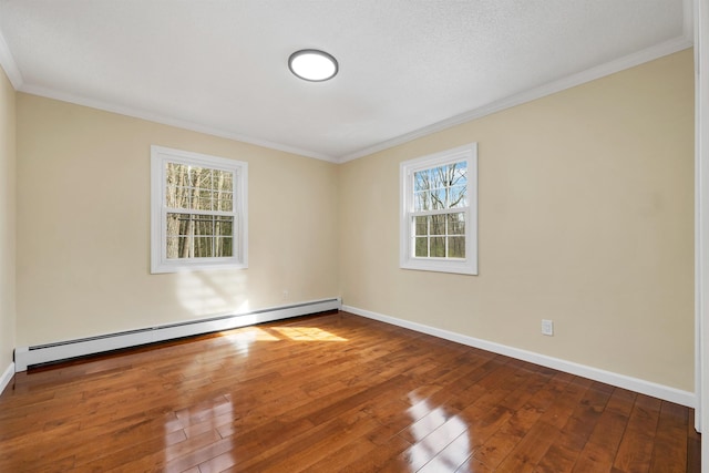 unfurnished room featuring a baseboard radiator, wood-type flooring, baseboards, and crown molding