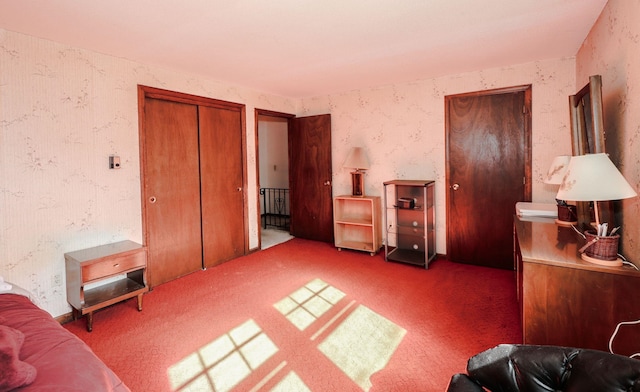 carpeted bedroom featuring wallpapered walls