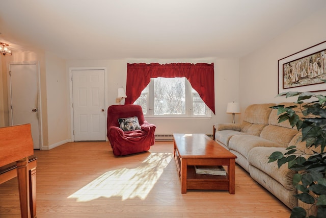 living room featuring light wood-type flooring, baseboards, and a baseboard radiator