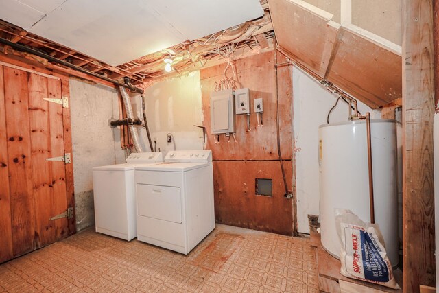 laundry area with electric panel, water heater, light floors, laundry area, and washing machine and clothes dryer