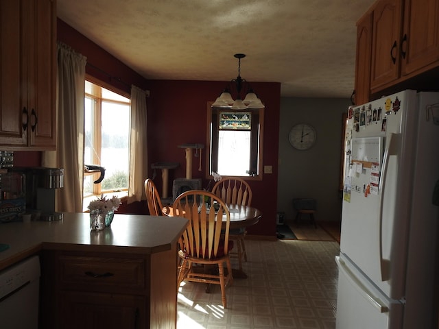 dining room featuring tile patterned floors and a textured ceiling