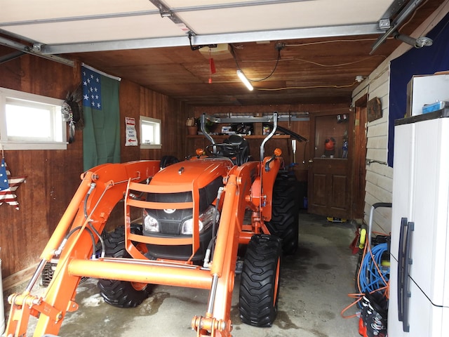 garage featuring wood walls